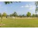Open green space and playground featuring slides and a covered play area at 7010 Broomshedge Trl, Winter Garden, FL 34787