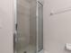 Bathroom shower with sliding glass doors and tile at 7010 Broomshedge Trl, Winter Garden, FL 34787
