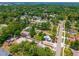 Aerial view displays the community with green trees and a nearby road at 7506 Mott Ave, Orlando, FL 32810