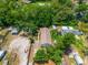 Aerial view of the surrounding wooded area around the home and neighborhood at 7506 Mott Ave, Orlando, FL 32810