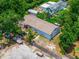 Overhead shot of property features a fenced yard with nearby trees at 7506 Mott Ave, Orlando, FL 32810