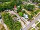 An aerial view of a property showcases the layout, including a long driveway and the surrounding neighborhood at 7506 Mott Ave, Orlando, FL 32810