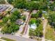 Aerial shot showcasing a property with red boundary lines, lush greenery, and a neighboring community at 7506 Mott Ave, Orlando, FL 32810