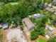 Aerial view of roof of home among the trees and greenery of surroundings at 7506 Mott Ave, Orlando, FL 32810