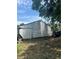 Exterior shot of the home's back yard, and siding at 7506 Mott Ave, Orlando, FL 32810