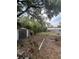 View of backyard with a shed and adjacent structure at 7506 Mott Ave, Orlando, FL 32810