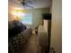 Bedroom with window, bed, carpet and ceiling fan at 7506 Mott Ave, Orlando, FL 32810