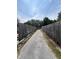 Long driveway between two fences at 7506 Mott Ave, Orlando, FL 32810
