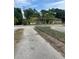 View down driveway toward house across the street at 7506 Mott Ave, Orlando, FL 32810