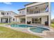 Backyard featuring a pool, spa, and patio with ample space for outdoor entertaining at 8210 Topsail Pl, Winter Garden, FL 34787