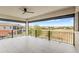 Large balcony overlooking a scenic view of the surrounding community, with black metal railings at 8210 Topsail Pl, Winter Garden, FL 34787