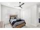 Bedroom with neutral tones, wood furnishings, and walk-in closet at 8210 Topsail Pl, Winter Garden, FL 34787