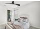 Bright bedroom with neutral tones, plush bedding, and ensuite bathroom at 8210 Topsail Pl, Winter Garden, FL 34787