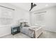 Bright bedroom with neutral tones, plush bedding, and large windows for natural light at 8210 Topsail Pl, Winter Garden, FL 34787
