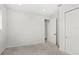 Neutral-colored bedroom with plush carpet, closet, and ensuite access at 8210 Topsail Pl, Winter Garden, FL 34787