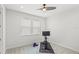 Bright room with neutral tones and modern ceiling fan ready for various activities at 8210 Topsail Pl, Winter Garden, FL 34787