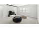 Upstairs bonus room with comfortable seating and a TV for entertainment at 8210 Topsail Pl, Winter Garden, FL 34787