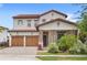 Charming two-story home with a brick driveway, two-car garage, tile roof, and well-maintained landscaping at 8210 Topsail Pl, Winter Garden, FL 34787