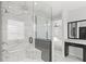 Bright bathroom features a glass shower, dual sink vanity and marble throughout at 8210 Topsail Pl, Winter Garden, FL 34787