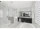 Luxurious main bathroom with dual sinks, glass shower, soaking tub, and marble accents at 8210 Topsail Pl, Winter Garden, FL 34787