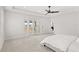 Spacious main bedroom with plush carpeting, balcony access, and an ensuite bathroom at 8210 Topsail Pl, Winter Garden, FL 34787