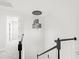 Modern staircase with a stylish chandelier and access to other rooms at 8210 Topsail Pl, Winter Garden, FL 34787