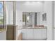 Bright bathroom features a double vanity, granite counters, white cabinetry, soaking tub, and large mirror at 850 Spring Oak Cir, Orlando, FL 32828