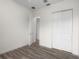 Bright bedroom features wood-look flooring, a closet, and neutral paint at 850 Spring Oak Cir, Orlando, FL 32828
