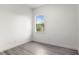 Bedroom with hard surface flooring, large arched window, and white paint at 850 Spring Oak Cir, Orlando, FL 32828
