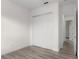 Bright bedroom features wood-look flooring and a closet at 850 Spring Oak Cir, Orlando, FL 32828