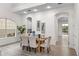 Elegant dining area with modern furnishings, ample natural light, and access to outdoor views, perfect for gatherings at 850 Spring Oak Cir, Orlando, FL 32828