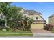 Charming two-story home with stone accents and lush landscaping at 850 Spring Oak Cir, Orlando, FL 32828