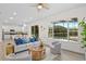 Bright living room with a view of the screened-in pool, open to the kitchen with modern finishes at 850 Spring Oak Cir, Orlando, FL 32828