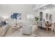 Open-concept living area flowing into a dining space, featuring modern decor and plenty of natural light at 850 Spring Oak Cir, Orlando, FL 32828