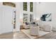 Bright living room with high ceilings, a large window, and stylish decor, creating an inviting and elegant space at 850 Spring Oak Cir, Orlando, FL 32828