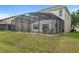 Screened in outdoor pool with rock waterfall feature at 850 Spring Oak Cir, Orlando, FL 32828