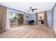 Bedroom with a ceiling fan, carpeting and a door leading to the bathroom at 9316 Dubois Blvd, Orlando, FL 32825