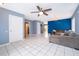 Cozy living room with an open layout, comfortable seating, and tile floors, ideal for relaxing and enjoying time with Gathering at 9316 Dubois Blvd, Orlando, FL 32825