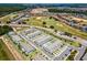 Scenic aerial view featuring beautiful residential neighborhoods, community landscaping, and golf course at 960 Golden Bear Dr, Reunion, FL 34747
