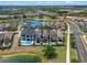 Beautiful aerial shot of luxury homes featuring private pools, serene lakes, and golf course views at 960 Golden Bear Dr, Reunion, FL 34747