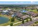 Lovely real estate aerial of a community featuring serene ponds, lush lawns, and luxury residences at 960 Golden Bear Dr, Reunion, FL 34747