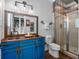 Industrial bathroom featuring a copper sink, metal fixtures, and a glass shower at 960 Golden Bear Dr, Reunion, FL 34747