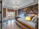 Themed bedroom with a boat bed, chandelier, mural, and balcony access at 960 Golden Bear Dr, Reunion, FL 34747