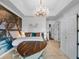 Themed bedroom with a boat bed, chandelier, mural, and ample natural light at 960 Golden Bear Dr, Reunion, FL 34747