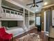 Spacious bedroom with custom built-in bunk beds, ceiling fan, zebra rug and lots of natural light at 960 Golden Bear Dr, Reunion, FL 34747