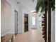 Bright foyer featuring tile flooring, a decorative front door, and a glimpse into the home's interior at 960 Golden Bear Dr, Reunion, FL 34747