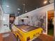 Game room with a unique taxi pool table and wall decor featuring NYC at 960 Golden Bear Dr, Reunion, FL 34747