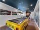 Game room with a unique pool table shaped like a taxi, and subway wall decor at 960 Golden Bear Dr, Reunion, FL 34747