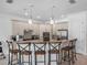 Well-equipped kitchen featuring stainless steel appliances, granite countertops, and breakfast bar seating at 960 Golden Bear Dr, Reunion, FL 34747