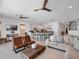 Bright and airy living space featuring a kitchen, stairs to the second floor, and comfortable living at 960 Golden Bear Dr, Reunion, FL 34747